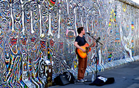 Busker at the Wall.